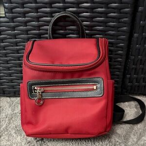Red Backpack with Black Trim and Front Zipper Pocket